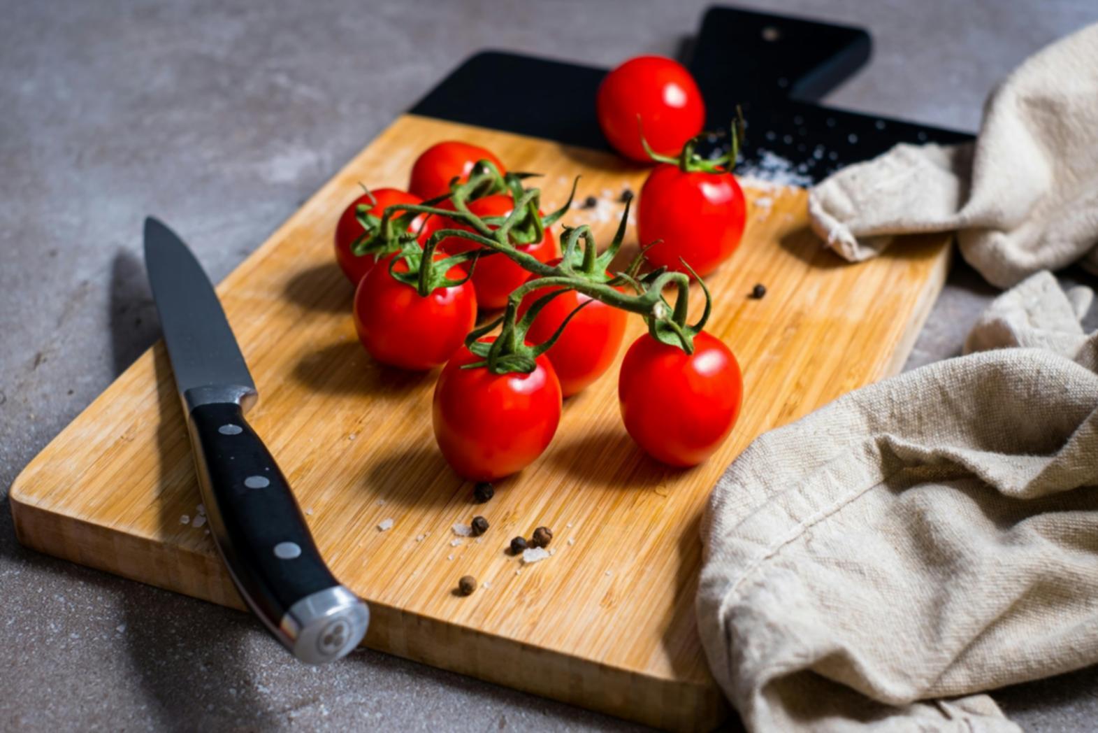 Team collaboration on recipe development and testing in professional kitchen environment
